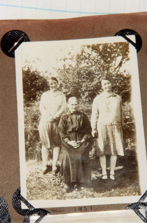 Copy of a photograph of Miss Skyrme on the right and Iris Morgan on the left with their mother in the middle